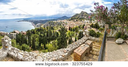 Panoramic Aerial View Of Ionian Seacoast Near Isola Bella Island And Taormina Old Town On Sicily, It