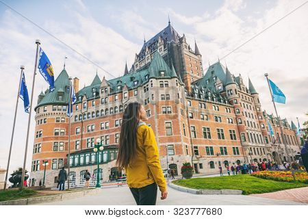 Quebec city travel woman walking on Promenade Terrasse Duffering visiting old town. Autumn Canada vacation destination for cruise ships.