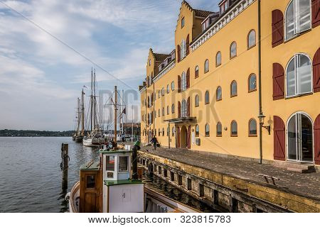Gods Depot And A Fishing Boat At The Quay Of Svendborg, Denmark, July 13, 2019