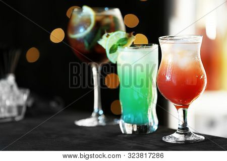 Row Of Different Fresh Alcoholic Cocktails On Bar Counter