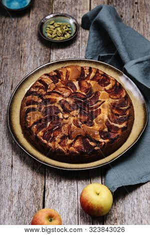 Eplekake. Traditional Norwegian Apple Cake Or Pie Sprinkled Sugar And Cinnamon On Old Rustic Wooden 