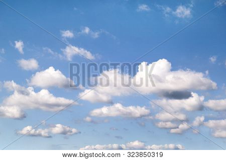 The Clear Blue Sky With White Clouds, Closeup. Very Fine Weather With Stratocumulus And Cumulus Clou