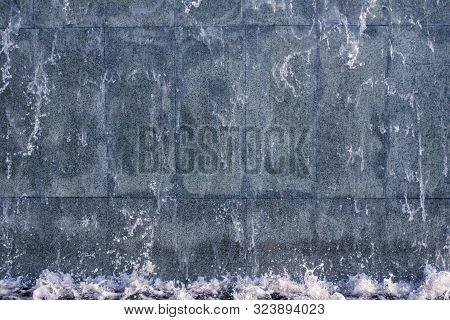 Running Water On Stone Background Texture. Abstraction Waterfall, Fountain Running Water