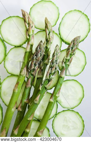Background With Cucumbers Slices And Asparagus. Close Up Of Fresh Cucumber Slices Top View Texture B