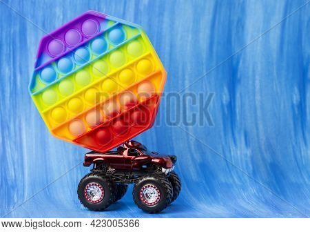 Sillicone Antistress Toy. The Car Is Carrying A Toy.