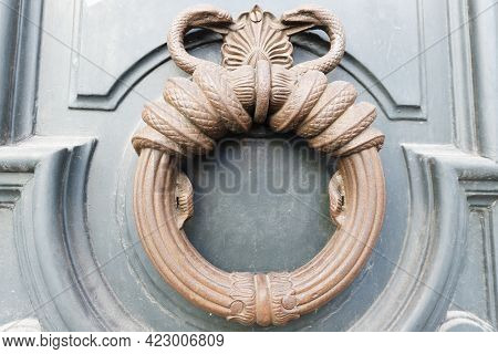 European Vintage Old Metal Wrought Iron Door Knocker. Design Detail. Paris.