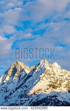 Snow Covered Mountain Peaks Of Dent De Veisivi And Denti De Perroc Above Val Herens In Switzerland A