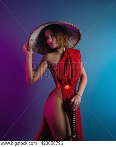 Sexy Woman In A Red Cape And An Asian Hat With A Katana In Her Hand Image Of A Samurai In Neon Color