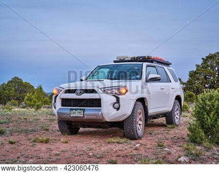 Dinosaur National Monument, CO, USA - May 18, 2021: Toyota 4Runner SUV (2016 Trail model) at dawn in arid landscape of north western Colorado along Yampa Bench Road, springtime morning scenery.