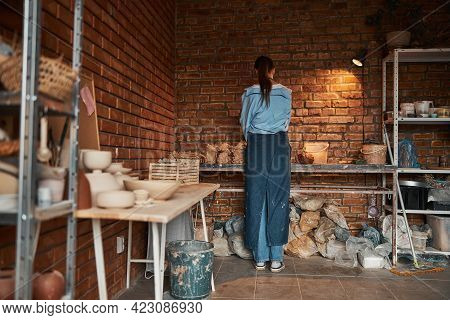 Charming Elegant Ceramicist Spending Time At A Hobby In Pottery Cozy Workshop