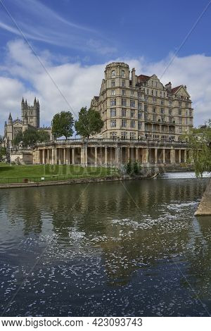 Bath, United Kingdom - June 8, 2021: Historic Buildings Line The River Avon As It Passes Through The