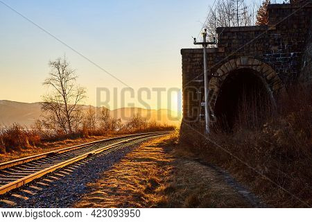 Tunnel On Circum Baikal Railway Running Along The Shore Of Lake Baikal On An Autumn Sunny Day With A