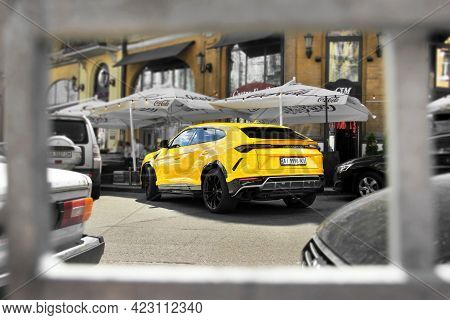 Kiev, Ukraine - May 22, 2021: Yellow Luxury Super Suv Lamborghini Urus In The City. Lamborghini Urus