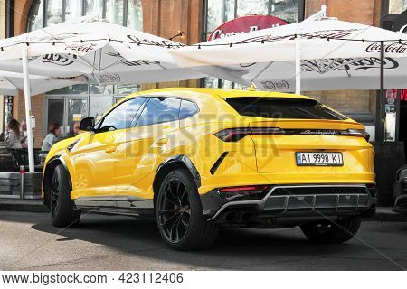 Kiev, Ukraine - May 22, 2021: Yellow Luxury Super Suv Lamborghini Urus In The City. Lamborghini Urus