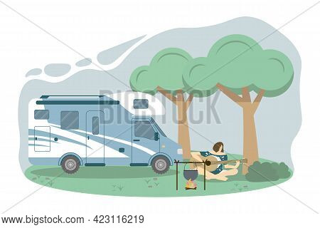 Caravan In A Forest. Local Summer Vacation. A Woman Is Playing The Guitar At The Camping Place. Conc