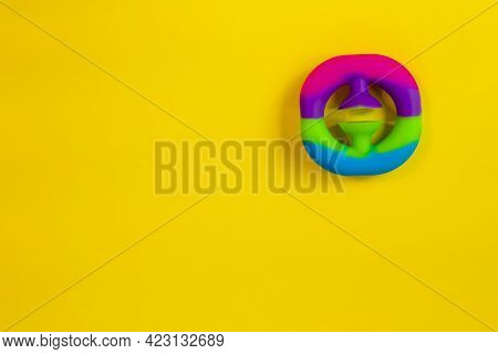 Trendy Anti-stress Toy Snappers Flat Lay On Yellow Background With Copy Space.