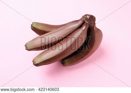 Tasty Red Baby Bananas On Pink Background, Top View