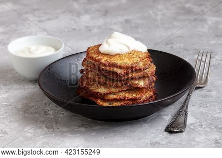 Potato Pancake With Cream Isolated. Bramborak, Vegetarian Diet. Crispy Draniki With Sour Sauce, Frie