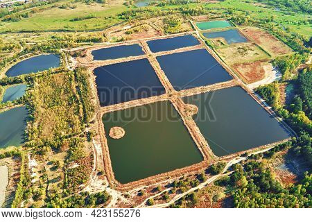 Aerial View Of Ponds For Collect Stormwater. Rainwater Retention Basins, Bird Eye View. Artifical Po