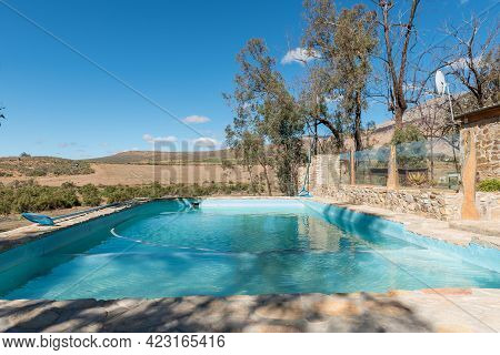 Seweweekspoort, South Africa - April 6, 2021: Swimming Pool At Op Die Plaas Camping Site At Sandrivi