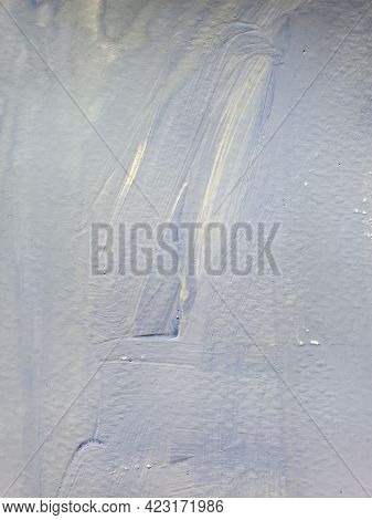Old Whitewashed Lime Wall Surface With Brushpaint Strokes. Grunge Background Texture Of Faded Light 