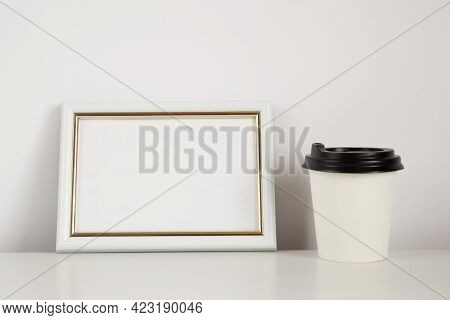 Coffee Cup Mockup With Empty Frame On The White Background, Copy Space.