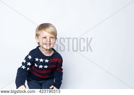 Happy Boy In Sweater With Usa American Flag On White Background With Copy Space.