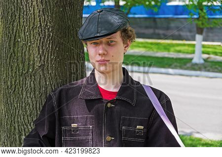 Sulky Young Bully With Black Jacket And Leather Black Cap With Bruise Eye