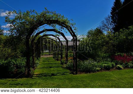 A View Of Wooden Garden Structures In The Grounds Of Drum Castle In Deeside, Scotland.