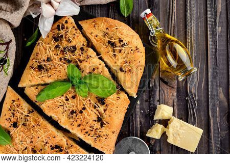 Traditional Homemade Italian Flat Bread Focaccia. Focaccia With Garlic, Parmesan And Basil Leaves, W