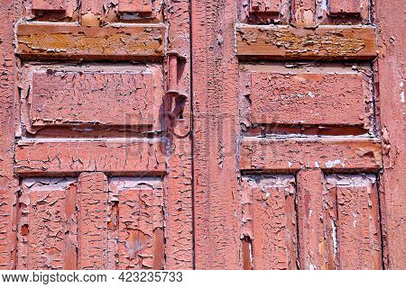 Texture Of The Old Door. Peeling Paint On Wooden Doors As A Deta