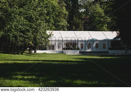 Buftea, Romania - June 6, 2021: Events Tent Inside A Green Forest.