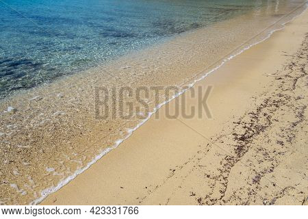 Sandy Beach, Ocean Sea Water Touches Wet Sand, Summer Vacations Concept