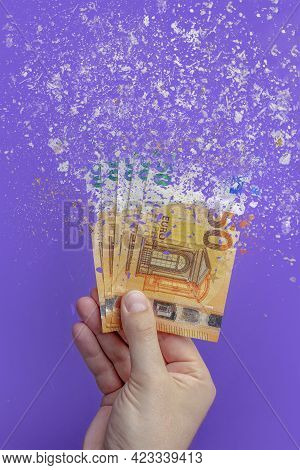 Spending Money, Spending All Money Is Illiterate. The Euro Banknote Turns To Ash, Dissolves Against 