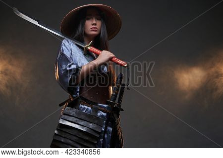Attractive Woman In Japanese Samurai Style With Katana