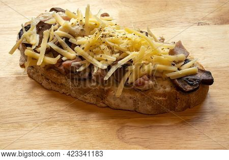 Overview Of A Slice Of Ham, Mushroom And Cheese, Tar-tine Isolated On A Plain Background