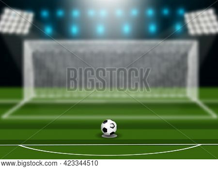 Soccer Ball On Green Field In Front Of Goal Post.