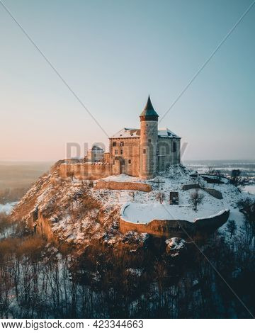 Kunetice Mountain Castle, State Castle Kuneticka Hora, Raby, Czech Republic. Winter Aerial Photograp