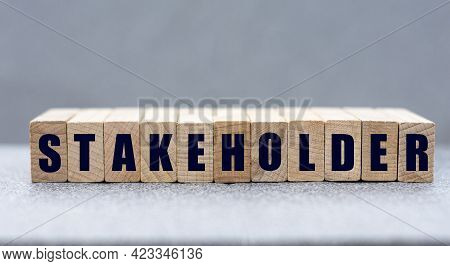 Stakeholder - Word On Wooden Bars On A Gray Background. Business Concept