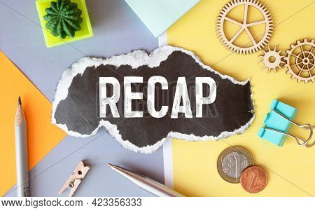 Recap - Text On Yellow Note Sheets On A Dark Wooden Background With Crumpled Sheets