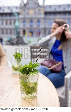 Lifestyle Portrait, Summer Non-alcoholic Drink, Refreshing Cold Drink. Young Brown Haired Woman Drin