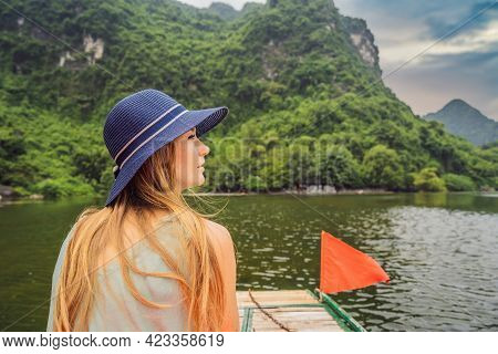 Woman Tourist In Trang An Scenic Landscape Complex In Ninh Binh Province, Vietnam A Unesco World Her