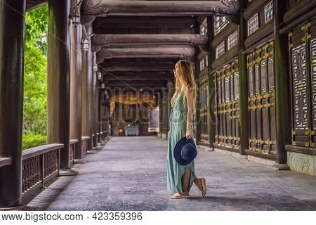 Woman Tourist In Temple Tower Of Bai Dinh Pagoda In Ninh Binh, Vietnam. Resumption Of Tourism In Vie