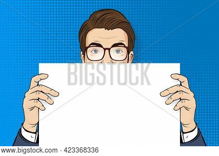 Pop Art Man. Man In Glasses Holding White Paper. Retro Halftone Background In Comic Style With Open 