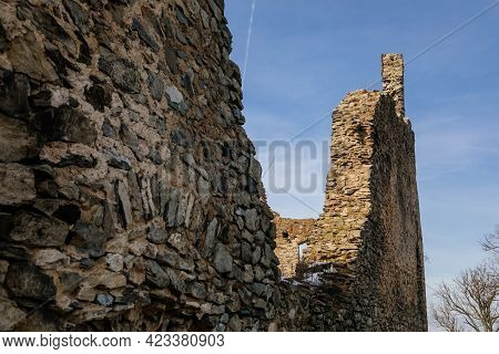 Medieval Gothic Castle Kostomlaty Or Sukoslav Under Snow, Grey Stone Ruin On Hill At Sunny Winter Da