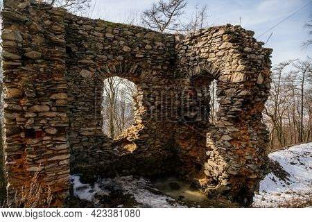 Medieval Gothic Castle Kostomlaty Or Sukoslav Under Snow, Grey Stone Ruin On Hill At Sunny Winter Da