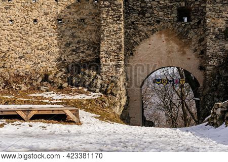 Medieval Gothic Castle Kostomlaty Or Sukoslav Under Snow, Grey Stone Ruin On Hill At Sunny Winter Da
