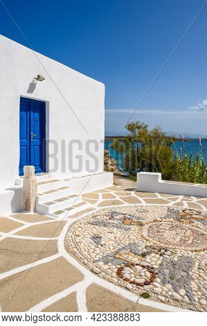 The Church Of Agios Ioannis Detis With Blue Door And Mosaic Pavement On Paros. Cyclades Islands, Gre