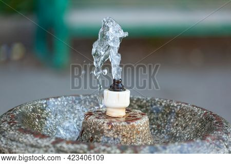 Close Up Water Drops Flowing From Fountain