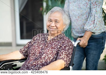 Help And Care Asian Senior Or Elderly Old Lady Woman Patient Sitting On Wheelchair At Home, Healthy 